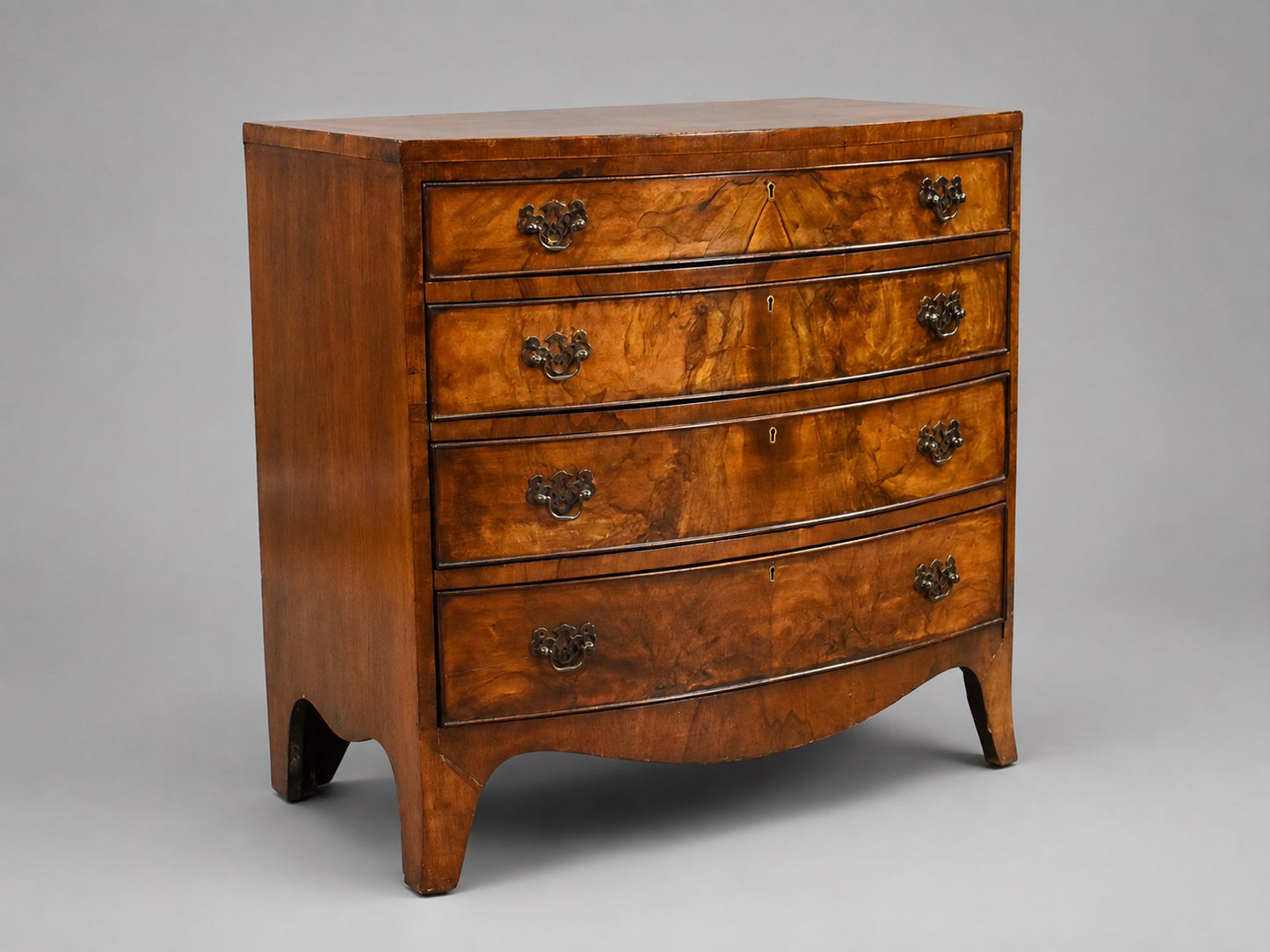 Early 20th Century Figured Walnut Bow front Chest Drawers