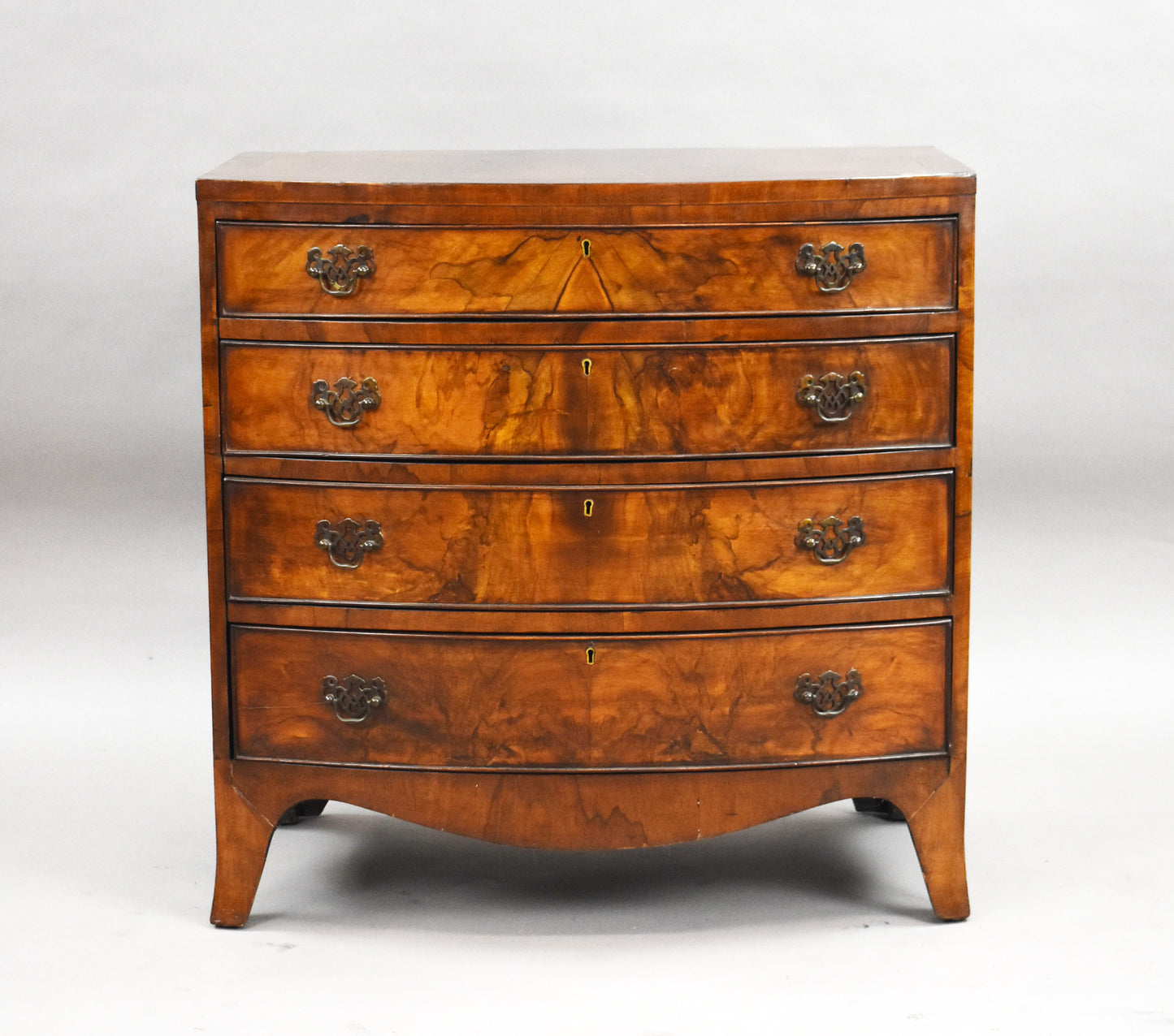 Early 20th Century Figured Walnut Bow front Chest Drawers